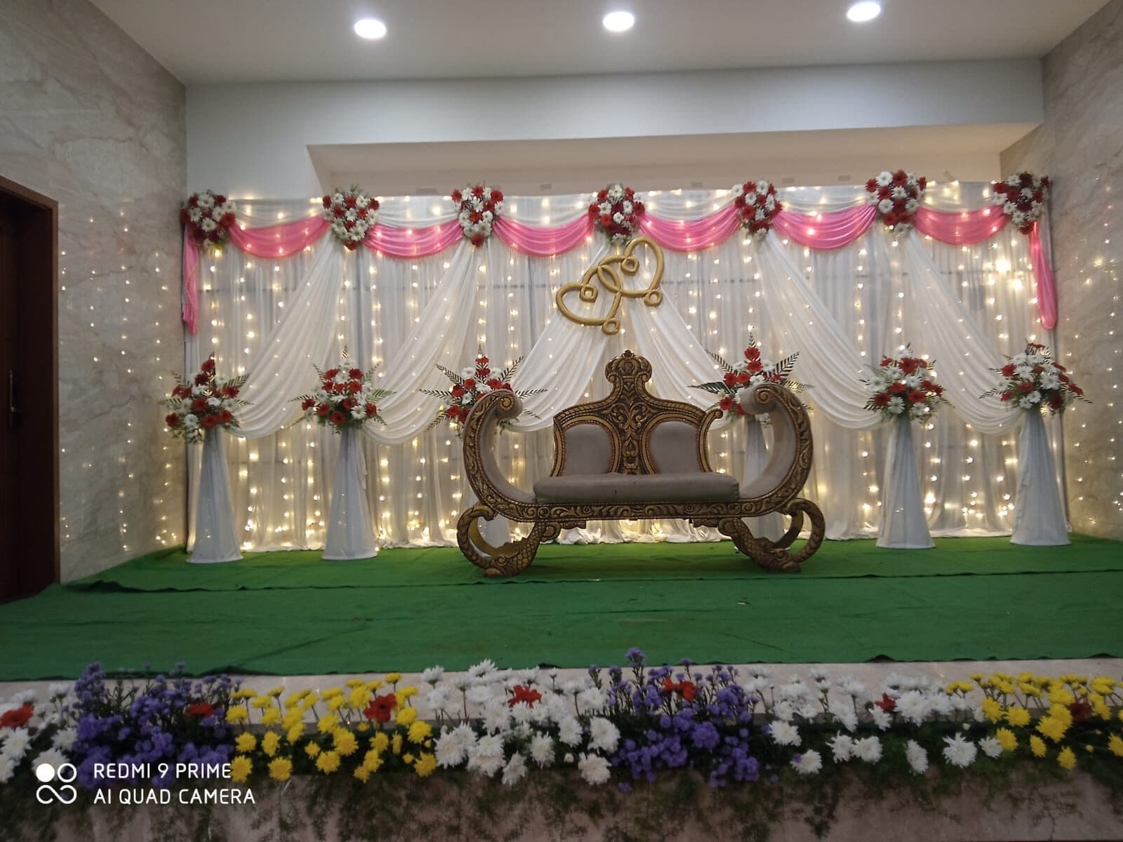 Pink floral wall with wisteria cascades