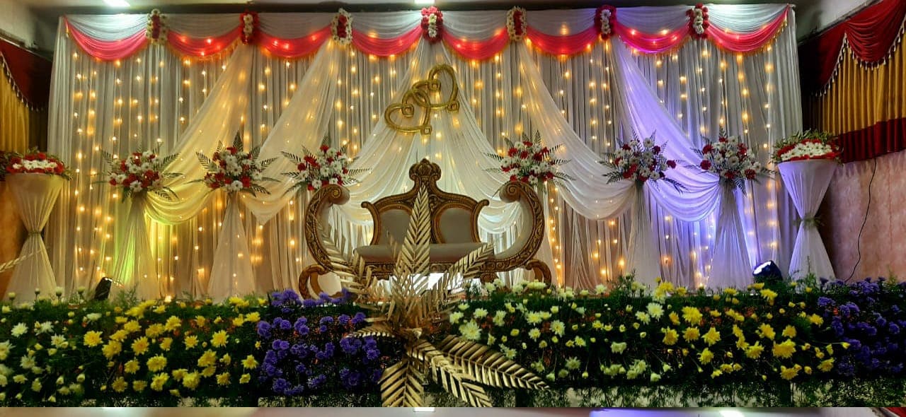 Cascading wisteria and colorful flower garlands